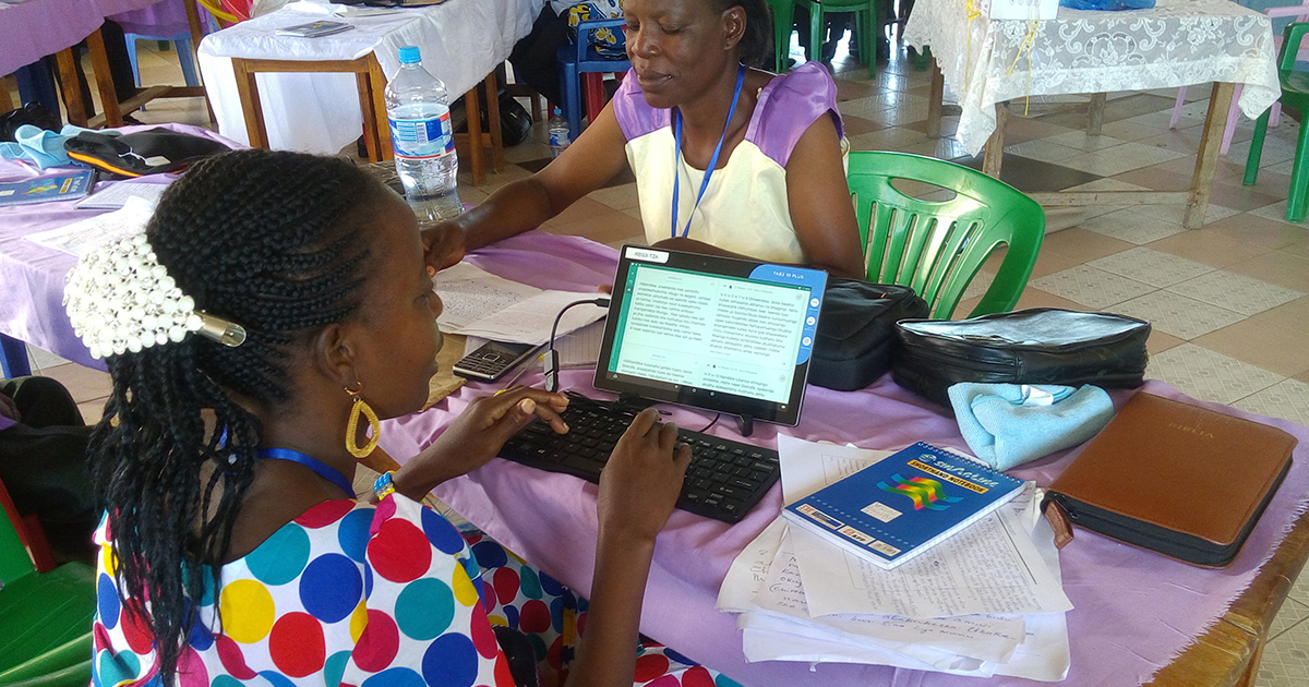 Bible Translators using Computer Tablets for National Translator