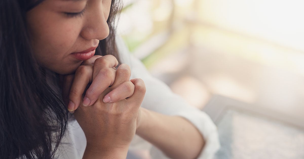 Young Woman praying 1200x628 | Wycliffe Associates | Accelerating Bible Translation