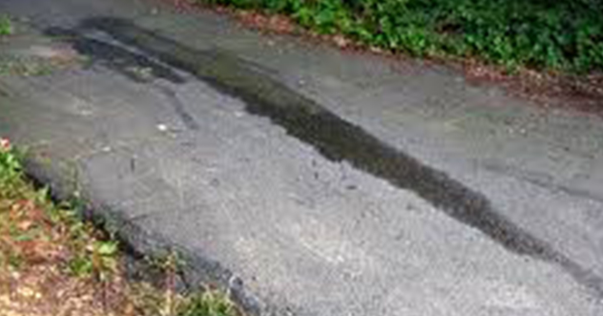 Photo of driveway with oil stains