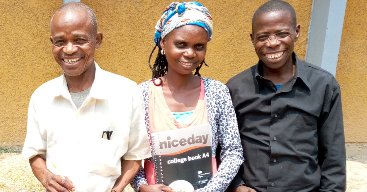 Three smiling Bible translators