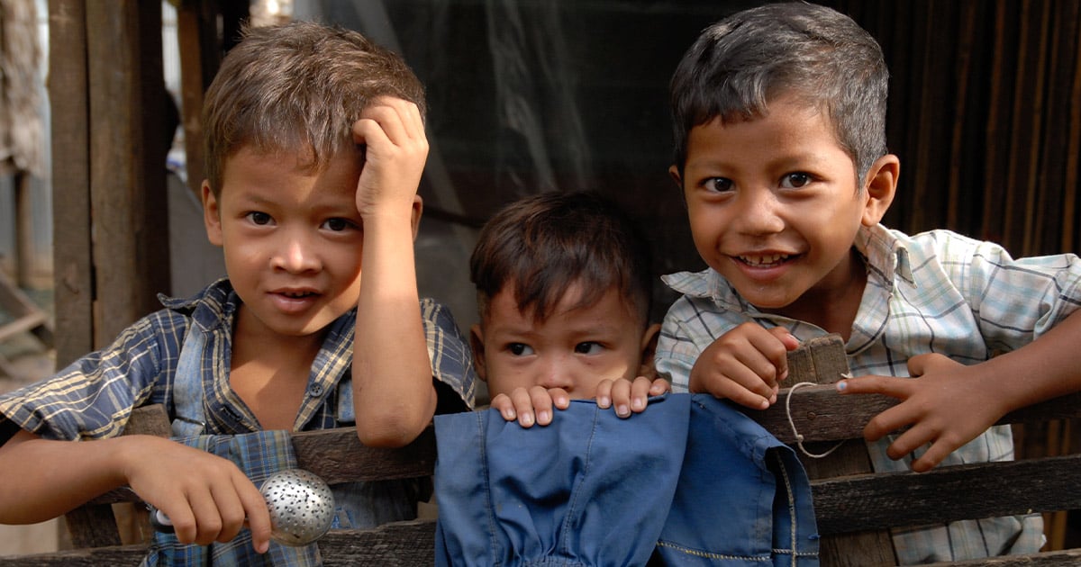 Three smiling children in Cambodia
