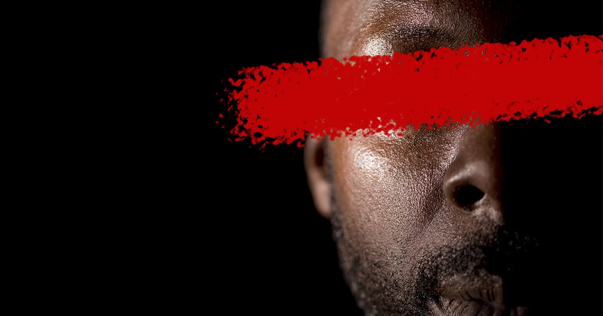 Man in the dark with identity censored Man in the dark with identity censored