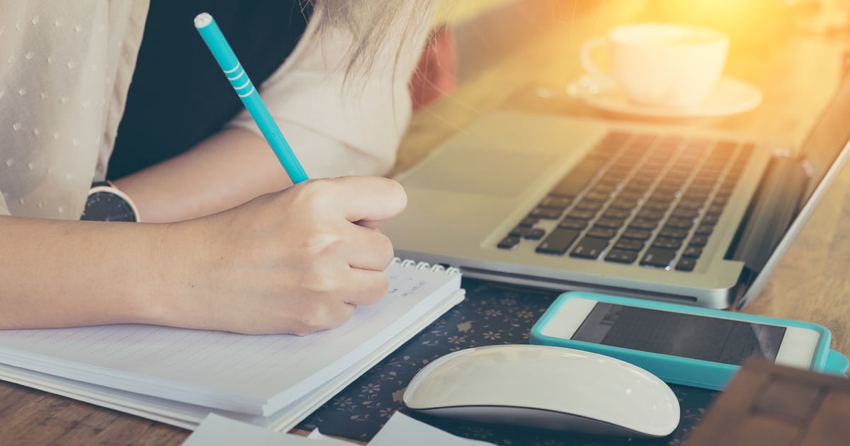 Woman studying online class at computer Woman studying online class at computer