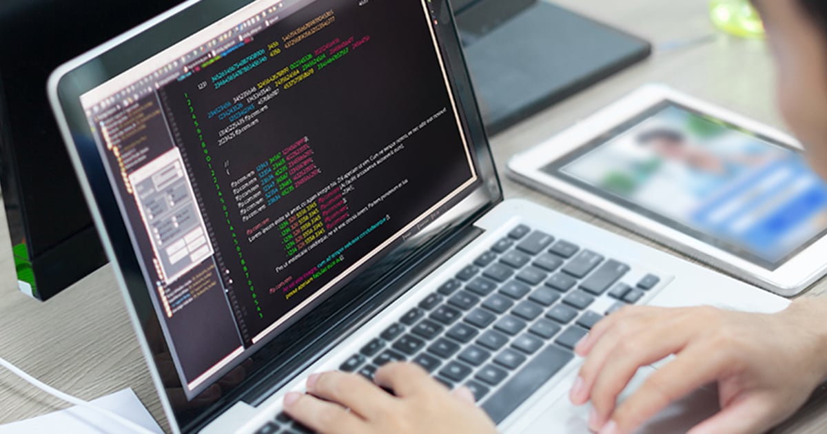 Person coding on a laptop Person coding on a laptop