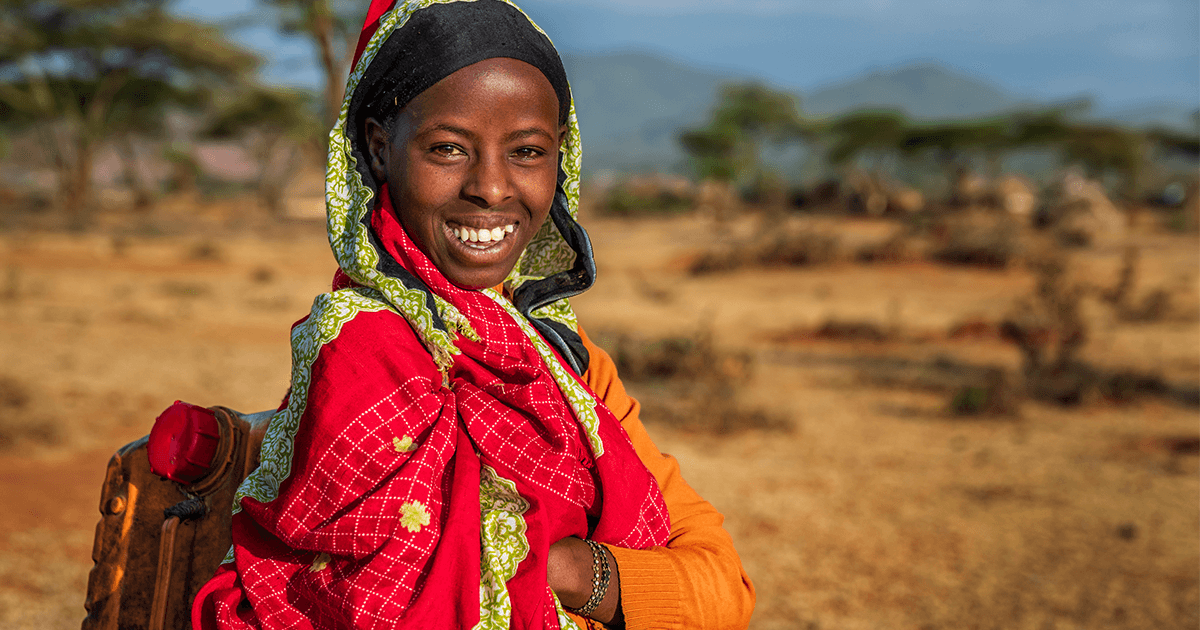 Girl Smiling in Africa because of Bible translation