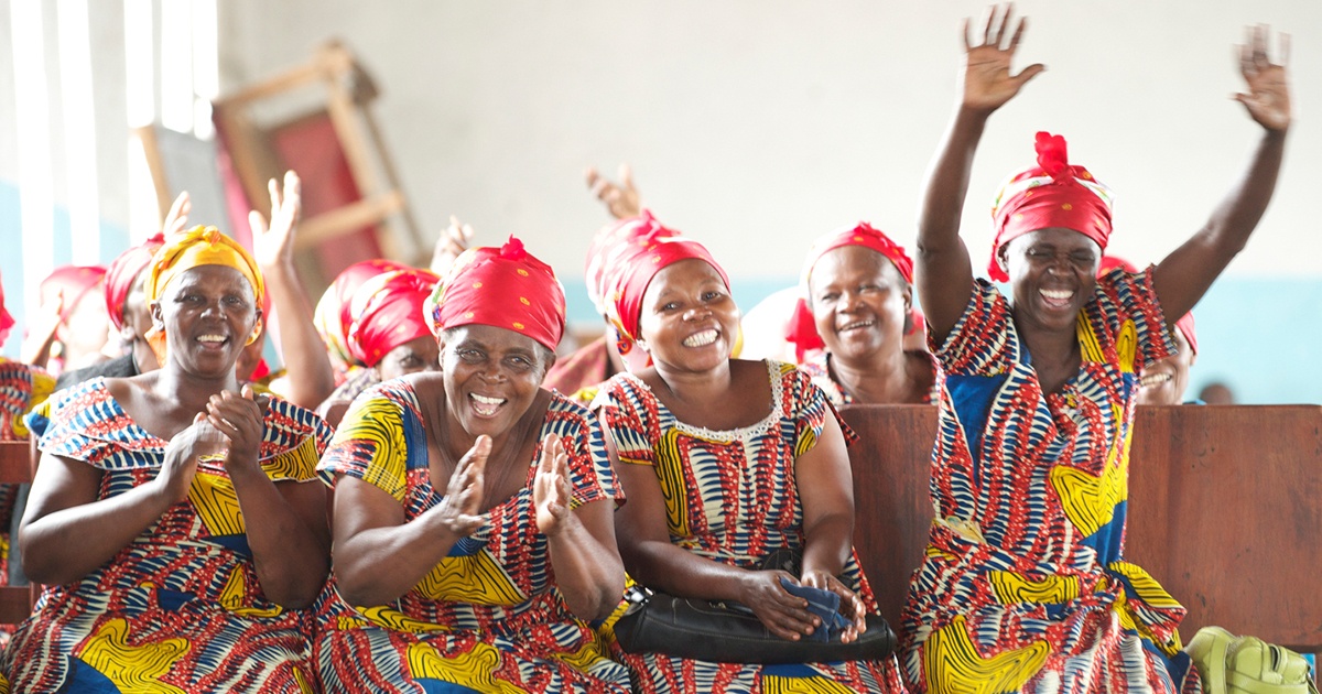 Photo of women celebrating in church | Accelerating Bible Translation