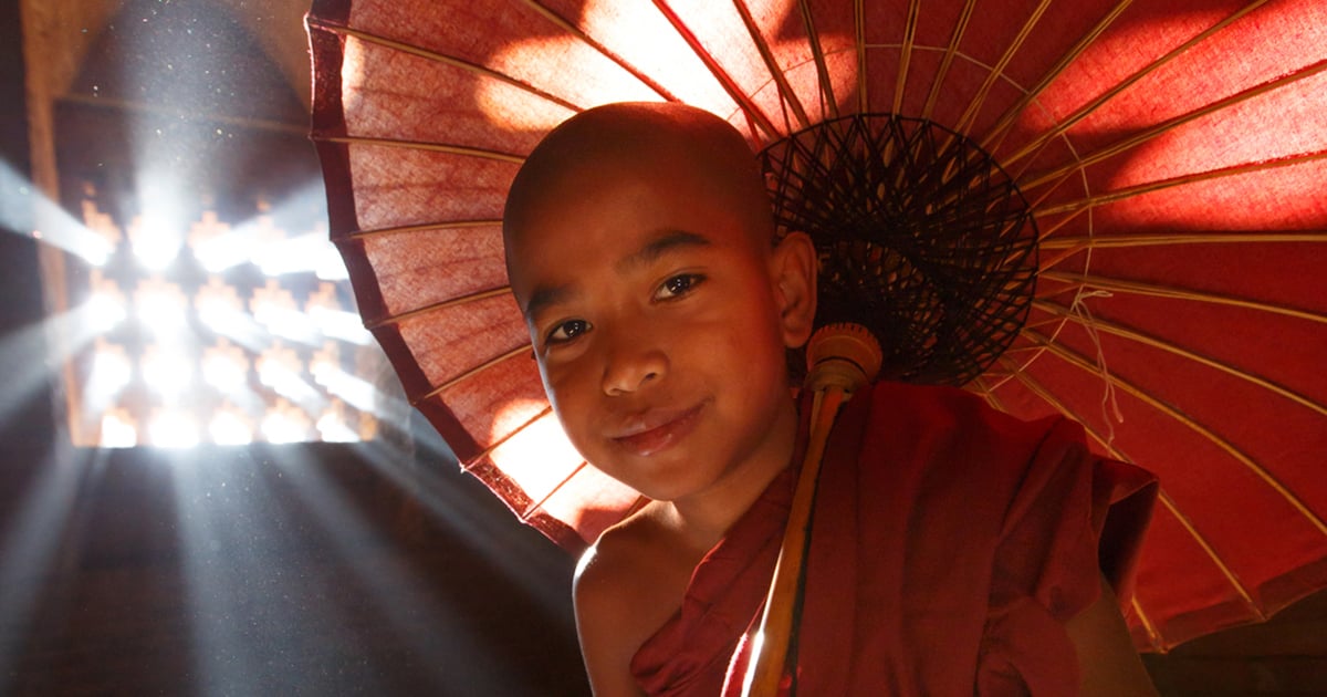 Boy in Light under Parasol in Asia Boy in Light under Parasol in Asia