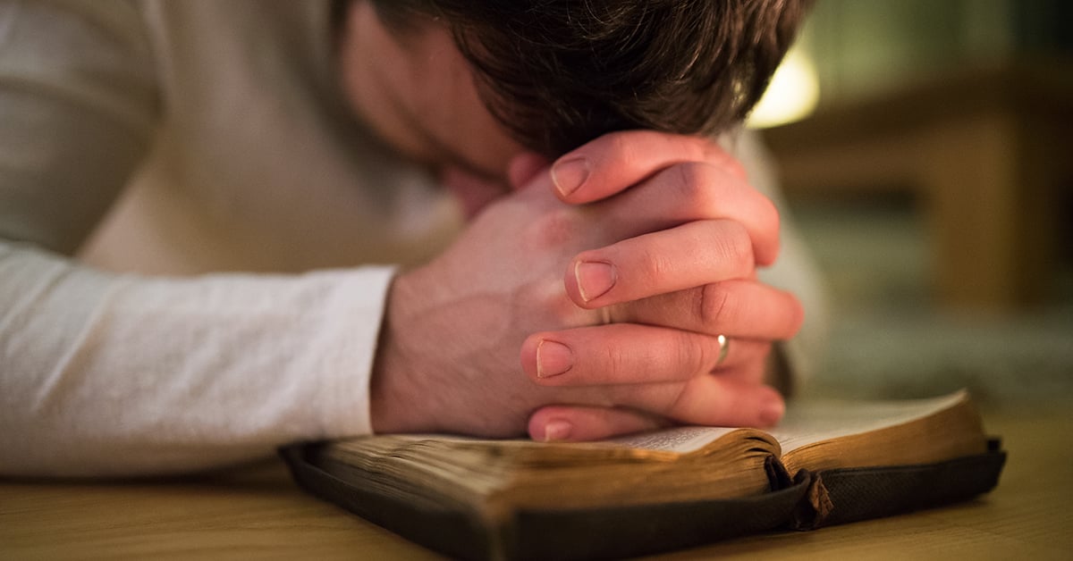 graphicstock-young-man-praying | Wycliffe Associates | Advancing Bible Translation