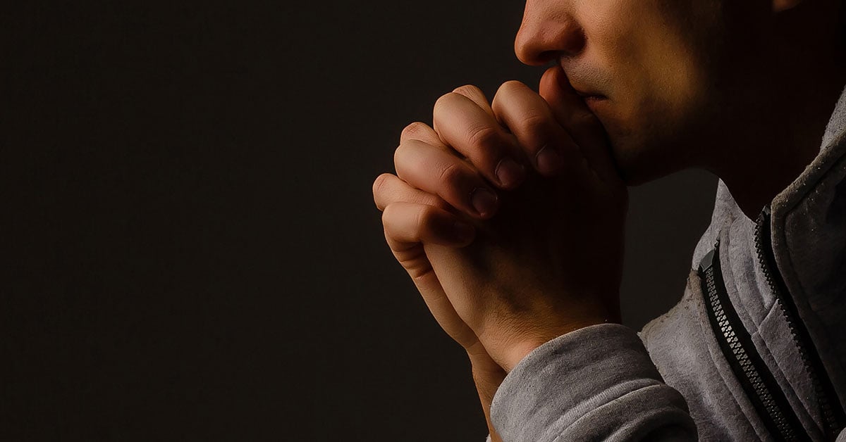 young man praying 1200 s 628